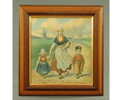 An early 20th century colour print on silk, depicting a Dutch family, mounted in a carved oak frame, overall measurements 79 