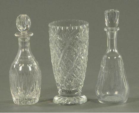 A Baccarat cut glass decanter, 20th century, a further cut glass decanter and a cut glass vase.