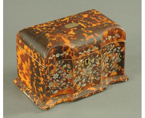 A blond tortoiseshell two division tea caddy, early 19th century, having a shaped front inlaid with mother of pearl flowers, 