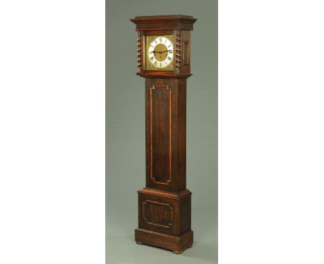 An oak longcase clock, with three-train striking movement, the case with applied mouldings and raised on short bun feet.  Hei