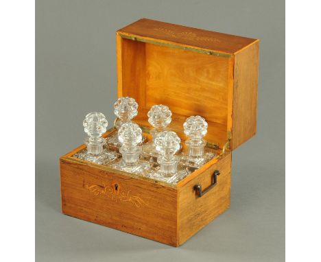 A George III inlaid rosewood decanter casket, containing six cut glass decanters, width 31 cm (see illustration). CONDITION R