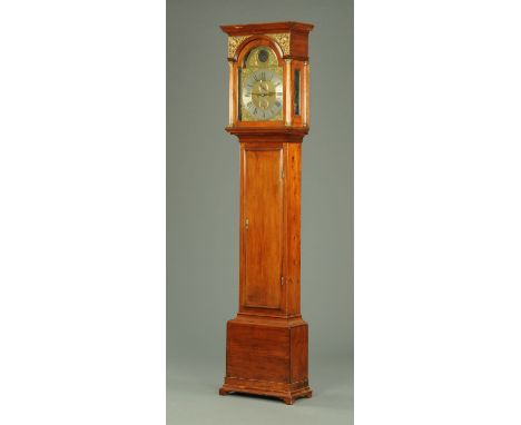 A Georgian walnut cased longcase clock, with moulded cornice above the arched glazed door enclosing the two-train striking mo