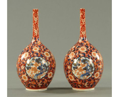 A pair of Japanese Koransha Imari shaped vases, circa 1880, with panels of pine and blossoming prunus surrounded throughout b