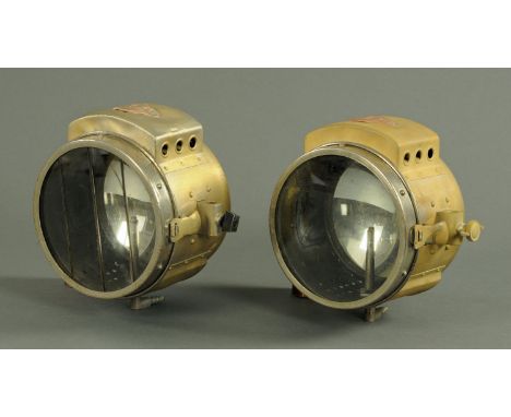 A pair of vintage car acetylene headlights, with applied copper label stamped The H and B Projector No. 1050 with concave int