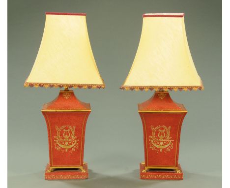 A pair of Regency Toleware style table lamps, 20th century, with tapering sides decorated with gilt lyres, ribbons, vases and