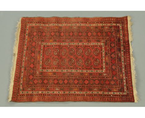 A Persian design rug, the centre rectangular panel with repeating octagonal designs and with multiple line border, principal 