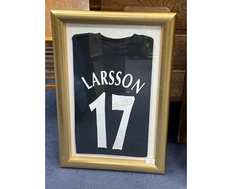 MANCHESTER UNITED 'LARSSON 17' TOP, bearing a signature, framed and under glass, 66cm x 45cm overall, along with a print titl