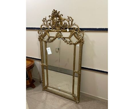 VICTORIAN OVERMANTLE WALL MIRROR, with wide plaster gilt floral crested, 107cm wide