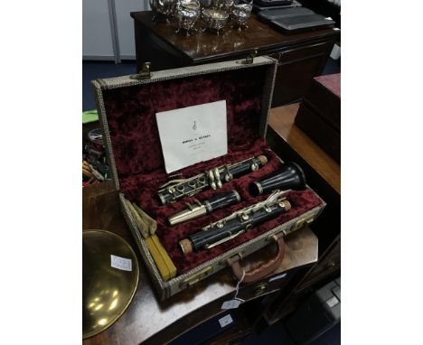 BOOSEY &amp; HAWKS CLARINET, in a fitted case, along with a brass trombone (2)