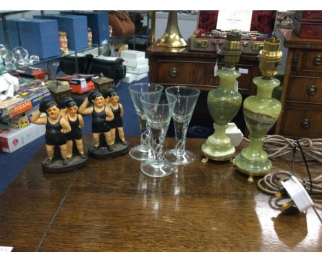 PAIR OF ONYX TABLE LAMPS, 23cm high to sconce, along with three wine glasses and two ceramic figures of Laurel and Hardy (7)