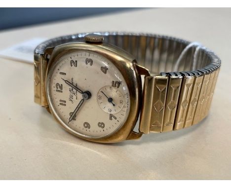 NINE CARAT GOLD CASED MANUAL WIND GENT'S WRIST WATCH, by J.W. Benson of London