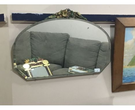 EARLY 20TH CENTURY WALL MIRROR, with floral painted barbola pendiment, 67cm wide
