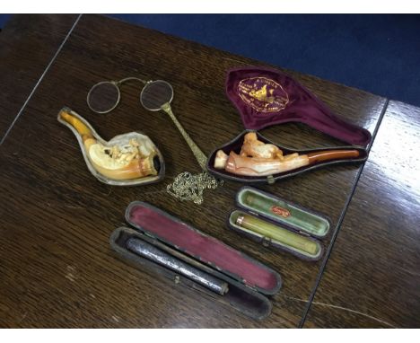 COLLECTION OF SMOKING ITEMS, comprising two meershaum pipes, along with a gold mounted cigarette holder, also another, all ca