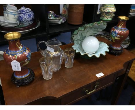PAIR OF CHINESE CLOISONNE ENAMEL VASES, with hardwood stands, 22cm high overall, along with a glass jug with enamelled floral