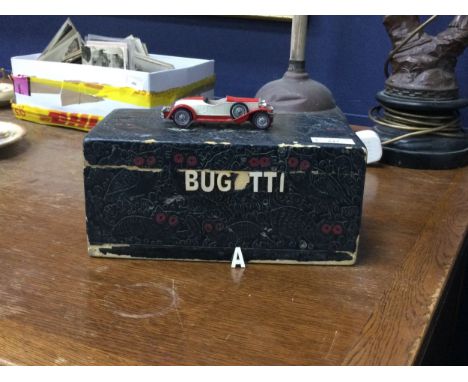 CASKET INSCRIBED BUGATTI, with car finial, 25.5cm wide