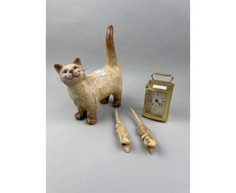 POTTERY FIGURE OF A CAT, along with two glass decanters,two carved bone crocodiles,reproduction carriage clock,group of forei