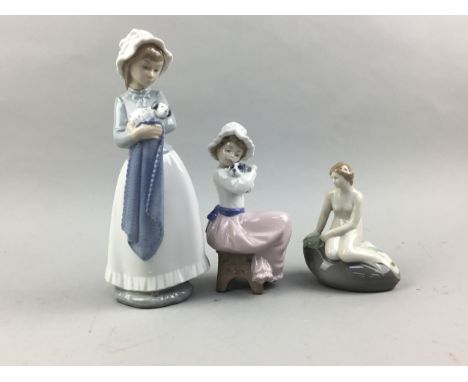 TWO NAO FIGURES OF GIRLS, along with a Royal Copenhagen figure of a girl, the taller figure 25cm high (3)