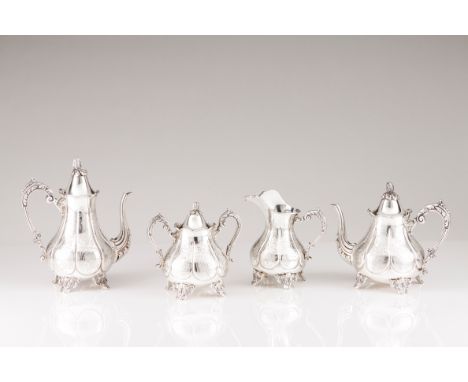 A Romantic style coffee and tea setPortuguese silver Pear shaped with engraved decoration; handles, feet and spouts decorated