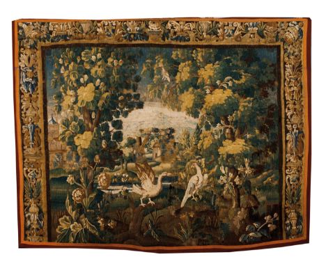 An Aubusson tapestry fragmentPolychrome wool depicting landscape with buildings and birds Foliage borders to sides and top Fr