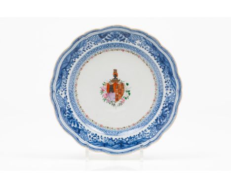 A scalloped plateChinese export porcelain Polychrome Famille Rose enamelled decoration with central armorial for António Joaq