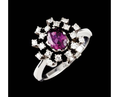 A ringWhite gold Set with one oval cut ruby (6 x 5 mm) and 20 8/8 cut diamonds Ant hallmark 800/1000 (1938-1984) and same dat