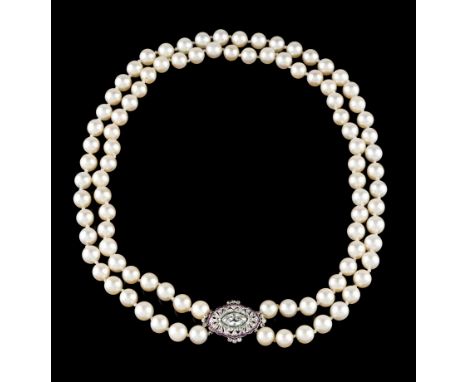 A pearl necklaceDouble strand of cultured pearls of 8,5/9mm Art Deco gold clasp set with one navette cut diamond (ca. 0.90ct)