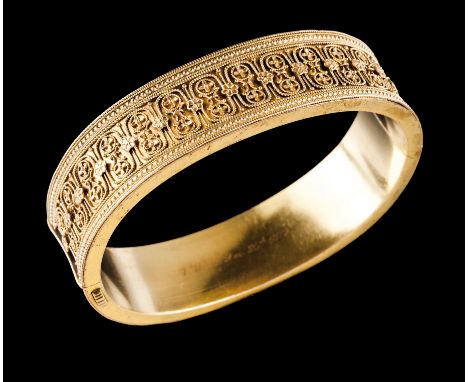 A Victorian braceletGold, 19th century Etruscan revival style bangle of part simulated rope twisted thread decoration and bea