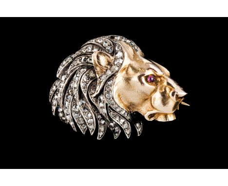 A broochSilver and gold Lion's head of mane set with small crowned rose cut diamonds and ruby eye Later marked Ram 585/1000 (