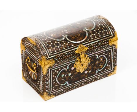 A Namban casketLacquered wood Of characteristic shape with domed cover Namban decoration of panels framed by incrusted mother