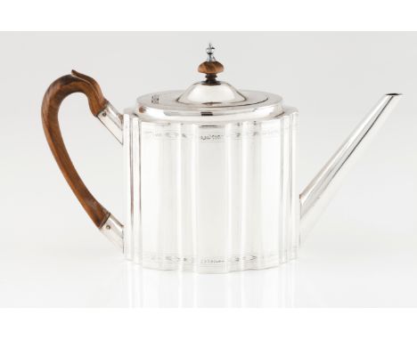 A D.Maria teapotPortuguese silver, 18th / 19th century Oval shaped body of horizontal fluting and two chiselled foliage bands