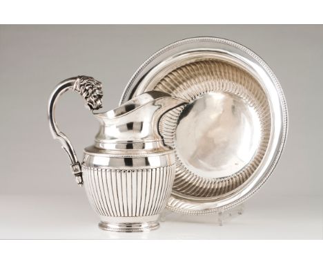 A ewer and basinPortuguese silver, 19th century Part fluted body of gadrooned lip Faceted handle of lion's head finial Oporto