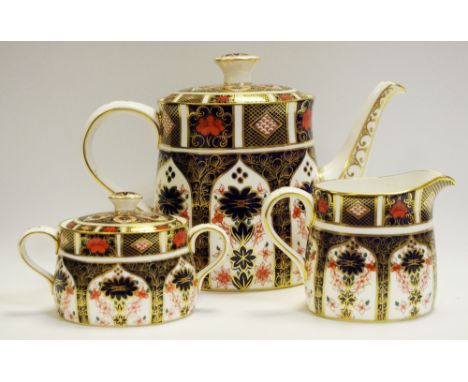 A Royal Crown Derby 1128 pattern tea pot; a similar sucrier and milk jug, all first quality (3)