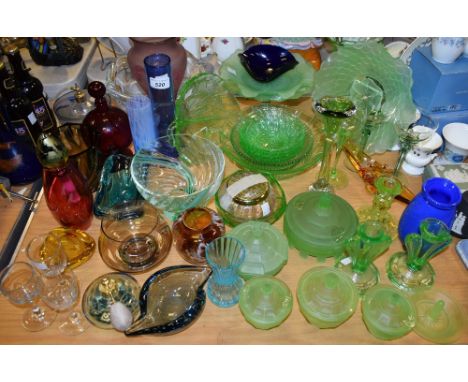 An early 20th century green glass press moulded glass cake stand, other plates; candlesticks, qty; other similar green glass,