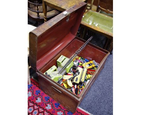 A large quantity of Corgi, Dinky, Tonka and Matchbox cars in a large metal trunk