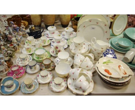 Ceramics - a Staffordshire floral printed coffee can and saucer; others similar to make a harlequin group; a rose printed par