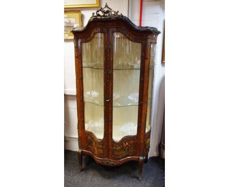 A Louis XVI style kingwood gilt metal mounted vitrine, serpentine bow front, pair of glazed doors