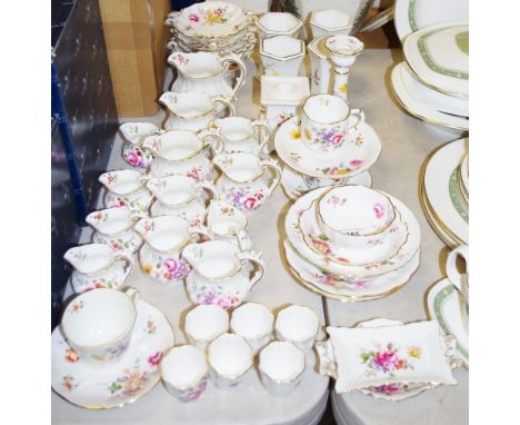 A quantity of Royal Crown Derby Posies pattern table ware, including cups and saucers, side plates, graduated jugs, a set of 