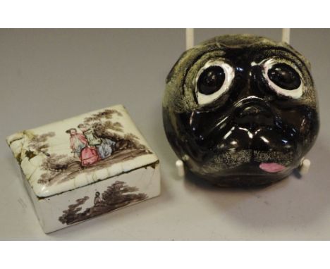 An 18th century Continental enamel novelty snuff box, boldly modelled as a pug's head, the hinged cover painted with a huntsm