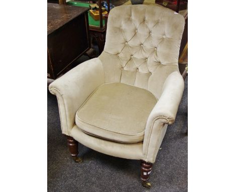 A Victorian button back armchair, upholstered in mushroom velour, c.1880
