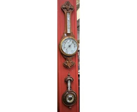 A late 19th/early 20th century oak cased aneroid barometer; another similar, smaller (2)