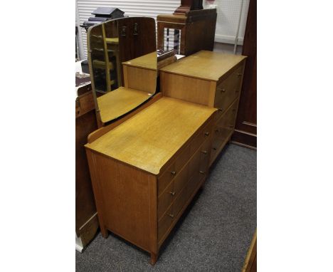 A mid-20th century retro light oak dressing table and chest of drawers, by Harris Lebus, London