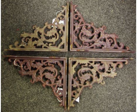 Four reproduction cast metal wall/shelf brackets