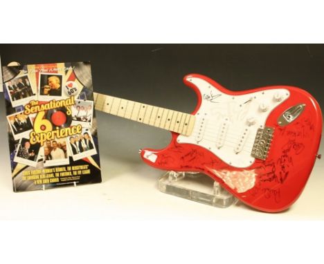 A Rockburn guitar signed by 1960's artists including Herman's Hermits, The swinging Blue Jeans, etc, won in a prize raffle at