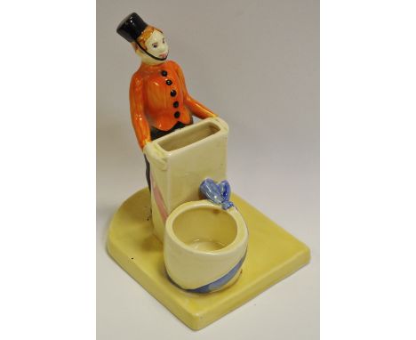 A novelty ceramic cigarette and match holder, as an usher standing, the base marked Ivan Golshovitch, approx 16cm high