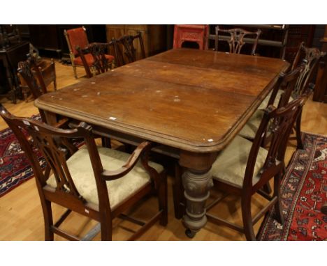 A set of eight Chippendale design dining chairs including two carvers; A Victorian mahogany extending dining table, rounded r