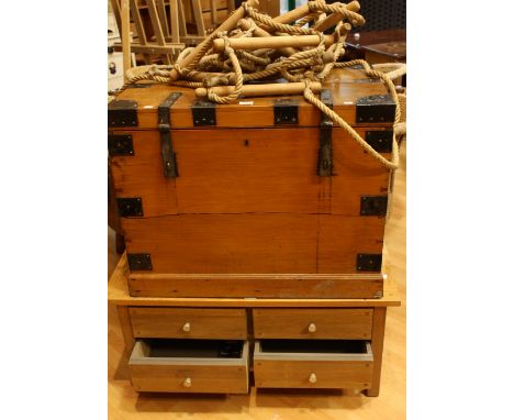 An oak coffee table/cabinet, rectangular top above four drawers; A 20th century pine campaign style metal bound travelling tr