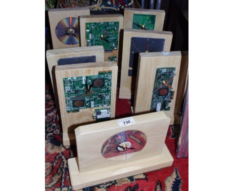 A novelty mantel clock, the face as a circuit board; others similar some with slate faces. (8)