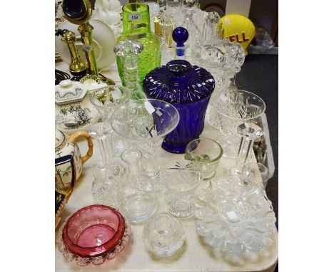 A cut glass pedestal vase; a Bristol Blue type slice cut pedestal waisted vase and cover; a cut glass ships decanter;others; 