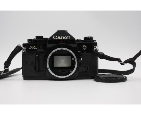 Canon A-1 35mm SLR Film Camera (Body ONLY) All Black Colour-Way w/ Instructions  NOTE: Camera has CANON COUGH &amp; will requ