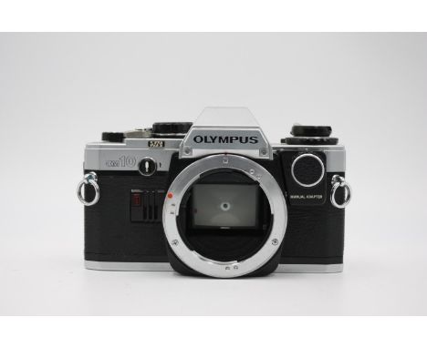 Olympus OM10 SLR Film Camera Body Only w/ Instruction Booklet w/ Manual Adapter (Allows User to Change Shutter Speeds)  The c